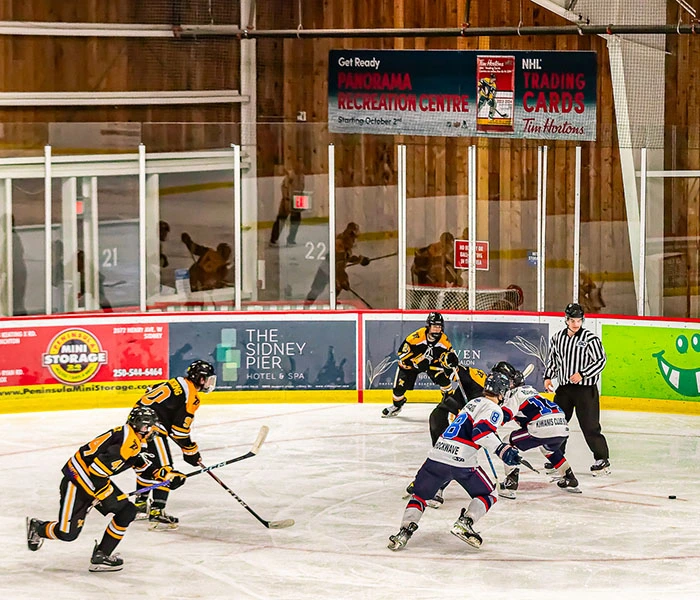 Hockey rink with branded rink board advertising in a Canadian community arena