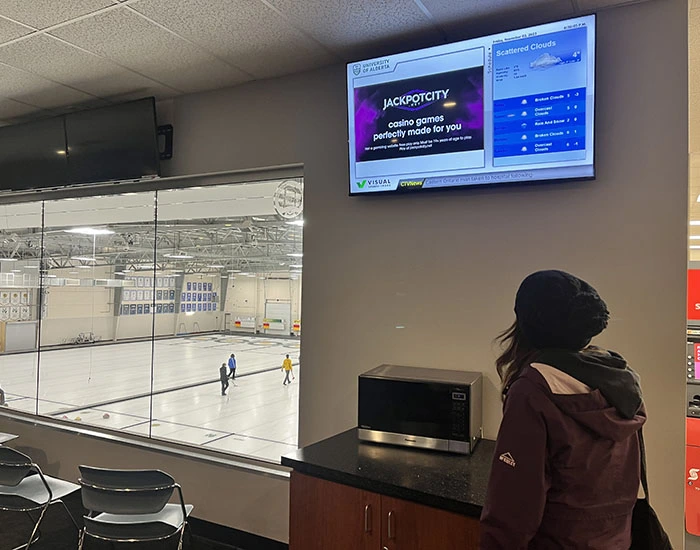 Hockey rink with branded rink board advertising in a Canadian community arena