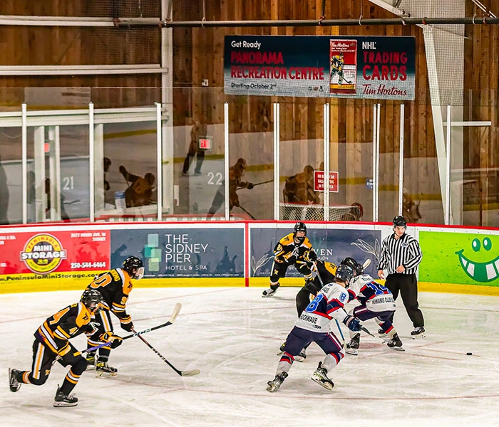 Hockey rink with branded rink board advertising in a Canadian community arena